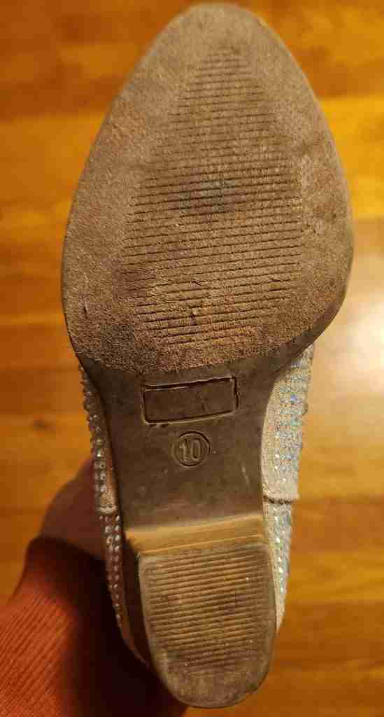bottom view of cowboy boot with not enough tread for horseback riding